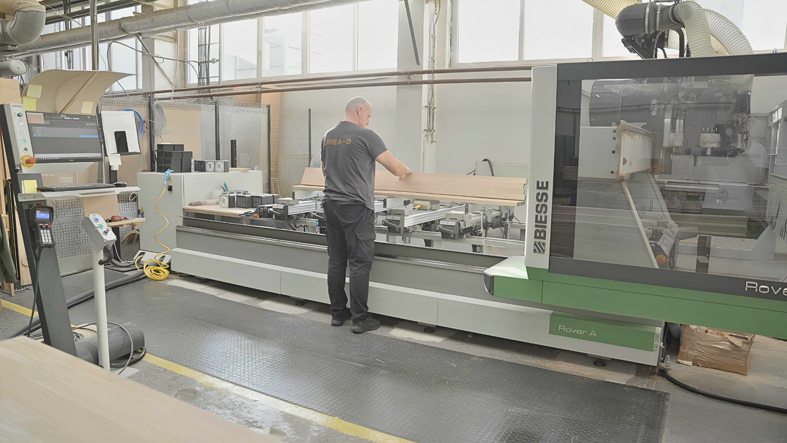 A Linea-D employee working at a CNC machine